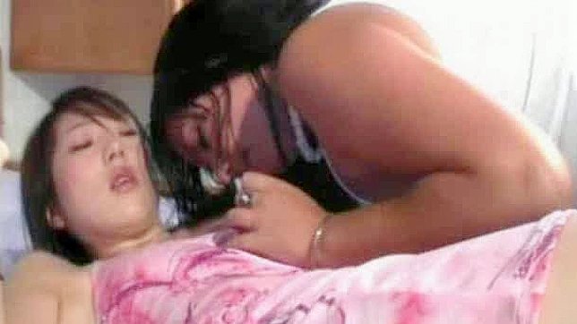 Two frisky Asian lesbians drill each other with big dildos