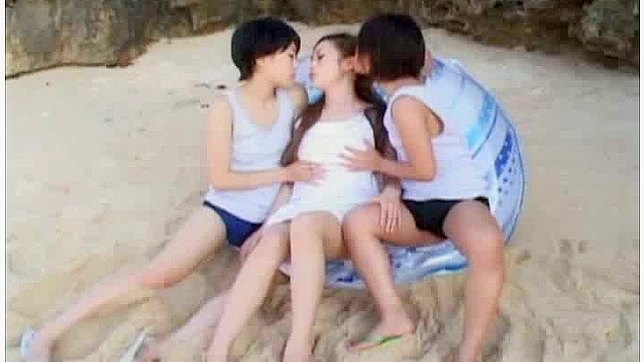 Three horny Asian lesbians play with a strap on