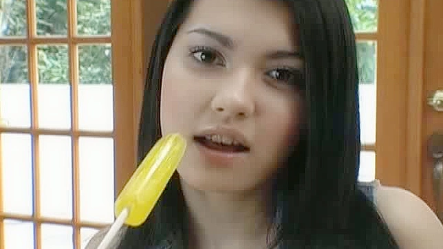 Busty Asian model Maria Ozawa enjoys a lollipop