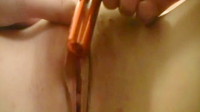 Tight little Asian slit gets toyed by bronze dildo