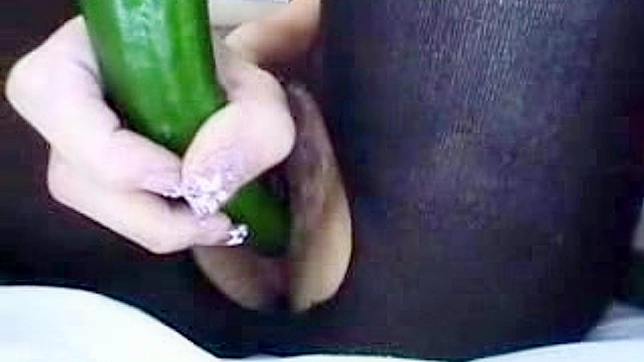 Japanese doll is banging her cunt with huge cucumber