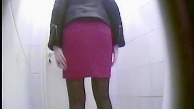Innocent and daring chick with upskirt is ing in the toilet