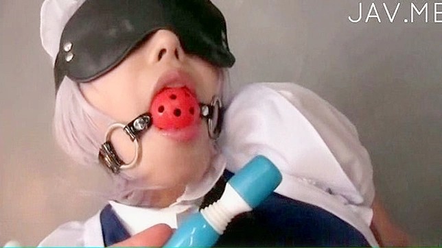 folded teen with gag in her mouth is masturbating indoors