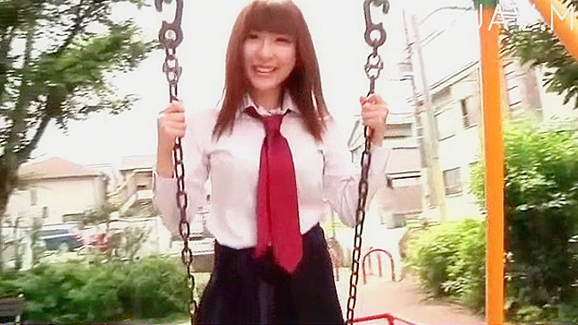 Provocative and hot japanese schoolgirl is posing outdoors