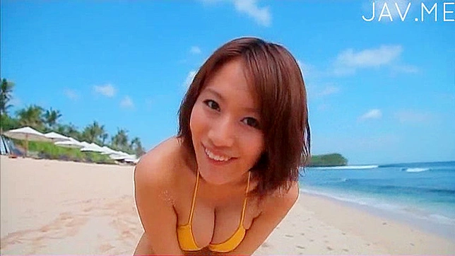 Winsome and hot japanese girl in bikini is posing outdoors