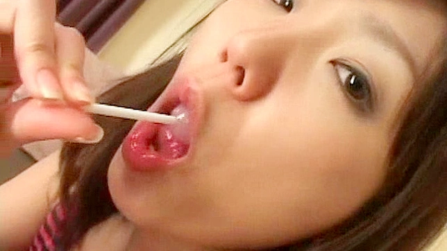 Sexy teen stops sucking a lollypop and instead sucks a cock