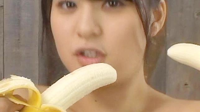 Busty and handsome asian teen is sucking big banana
