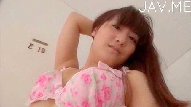 Handsome and hungry asian solo girl is posing on the floor
