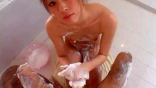 Soapy massage along Japanese babe in heats