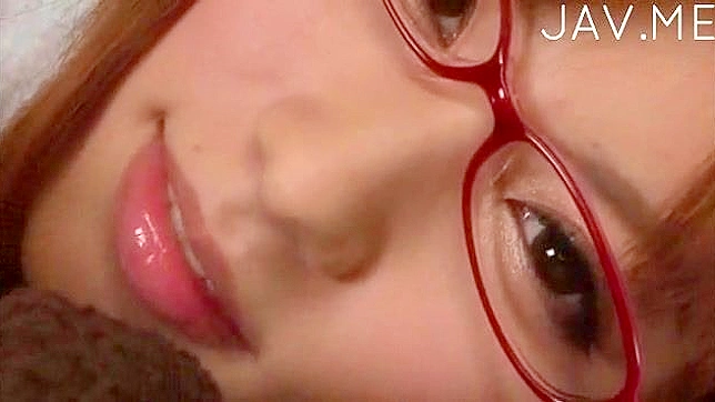 Japanese babe with glasses blows cock like a true goddess