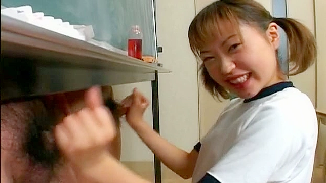 Happy and nice looking japanese chick is doing handjob