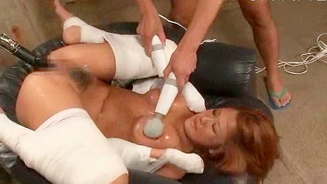 Busty Japanese babe receives multiple sex toys stimulation