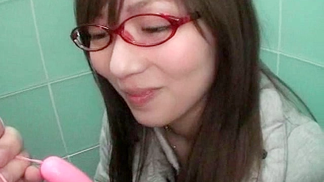 Nerdy and amateur asian teen with glasses is sucking big erection