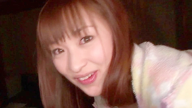 Redhead and happy japanese girl is kissing her bf in the room