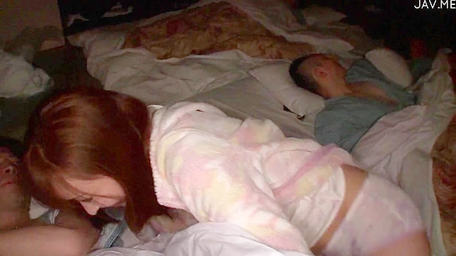 Redhead and happy japanese girl is kissing her bf in the room