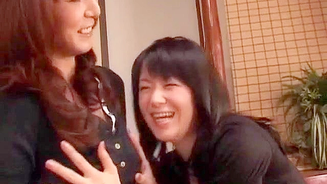 Pretty Asian lesbians are having wild fun with a dildo