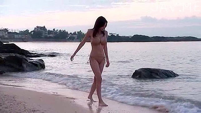 Busty and handsome asian solo teen is walking on the beach