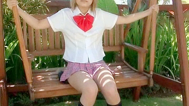 Blonde pornstar in a school uniform shows off her beautiful legs