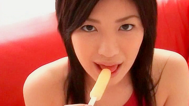 Sexy babe licks a lollipop