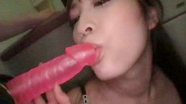 Chick licks a dildo and drills pussy