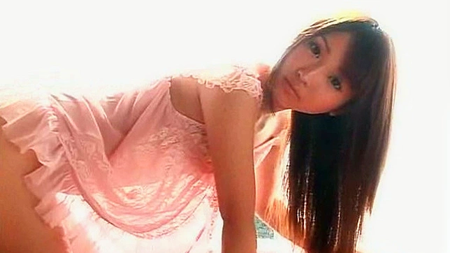 Graceful and amateur japanese solo teen is posing indoors
