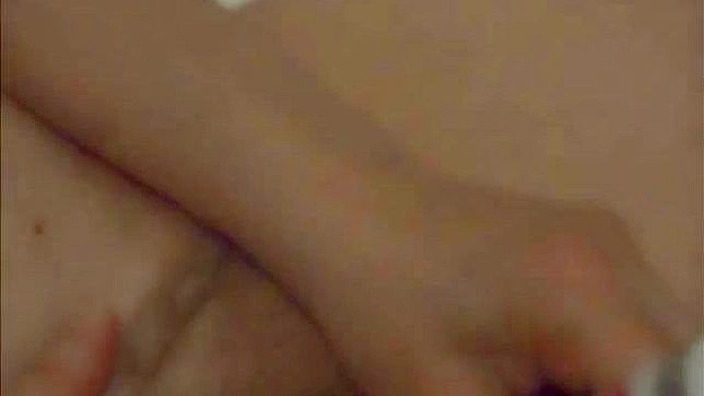 Horny Asian MILF masturbates