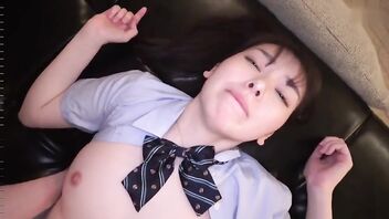 Japanese schoolgirl is wearing a uniform as she is fingered and fucked in doggy