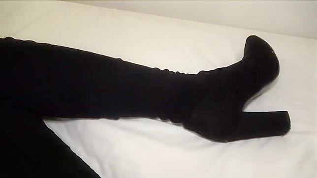 Horny Japanese bitch with long legs wearing her boots for the penetration