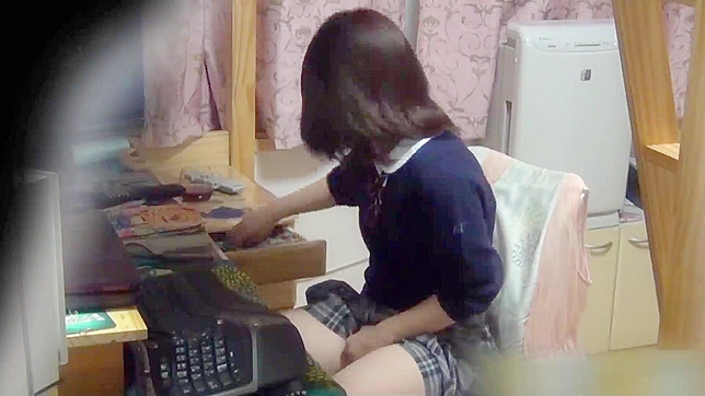 Caught Japanese teen masturbate with remote controller to porn on hidden cam