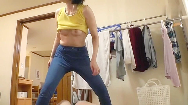 Japanese MILF with short hair is going to get fucked through her denim pants