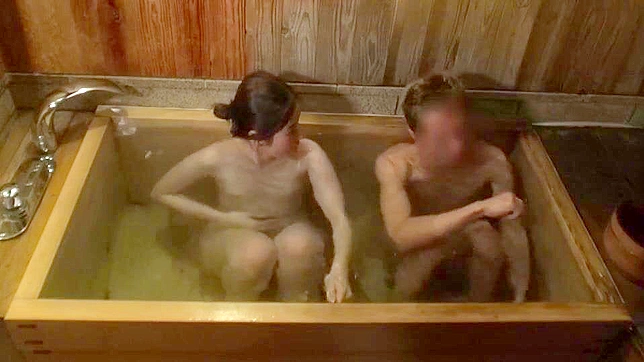 Vacationing Japanese couple are relaxing in a tub and then have missionary sex