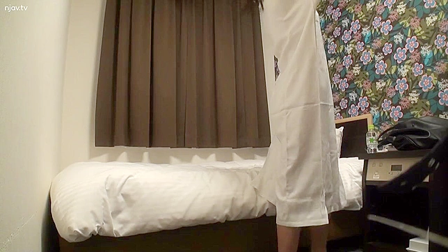Hidden Camera Set Up by Voyeur Captures Japanese Woman Masturbating in Hotel Room