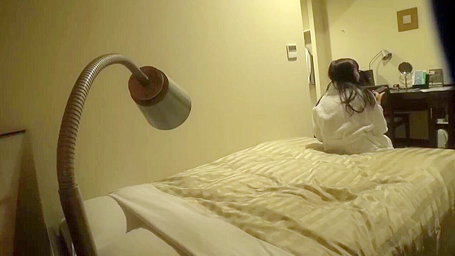 Japanese Woman Unaware of Voyeur's Spy Cam Masturbates Unknowingly in Hotel Room