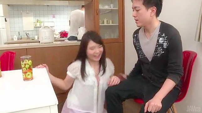 Sexy Asians daughter pleasures boyfriend while dad cooks dinner in kitchen