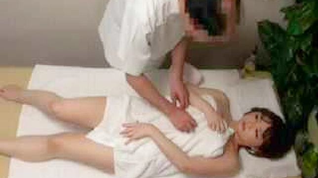 Racy Asian Beauty Undergoes Kinky Massage with Shocking Twist