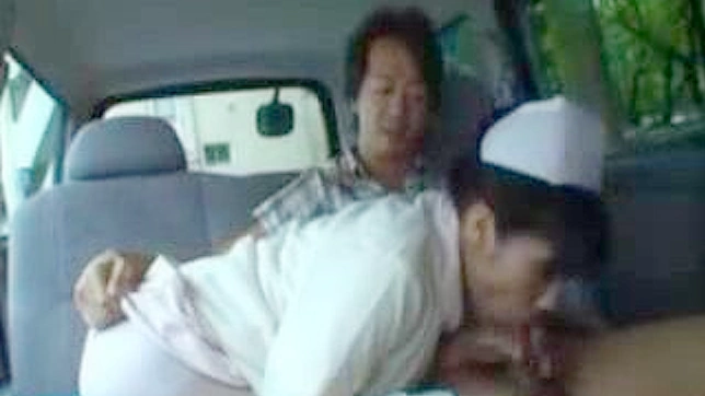 制服姿のアジア人看護師が車の中でフェラチオをする