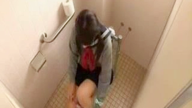 Masturbating Oriental schoolgirl in toilet