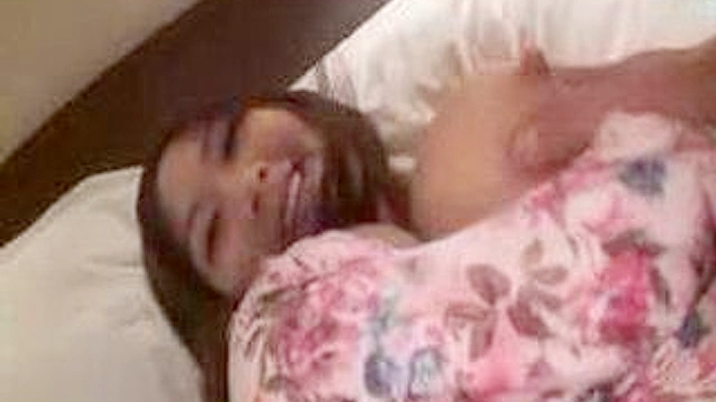 Nice boobed Asian girl gets fucked on bed