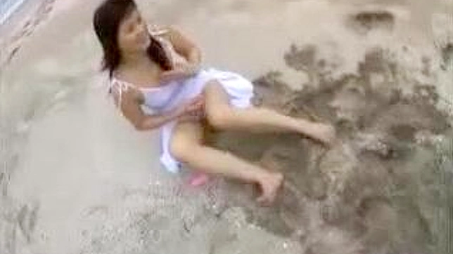 Sexy Japan beach babe wanks off two guys
