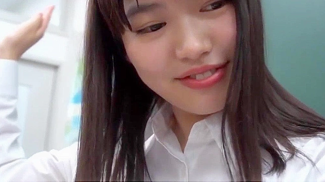 Japanese Lesbian Teacher Spanks Brunettes in Porn Video