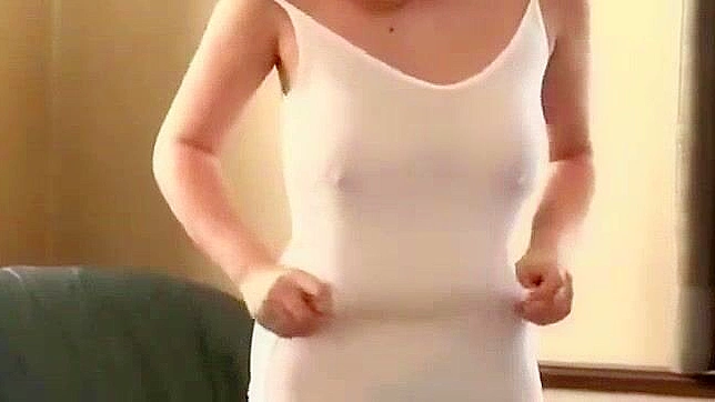 Japanese Teacher's Big Tits Take Center Stage in Hardcore Porn