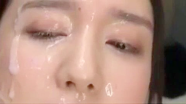 Japanese Office Lady Gets Drenched in Cum during Epic Bukkake Session