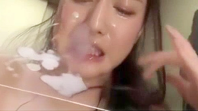 Japanese Office Lady Gets Drenched in Cum during Epic Bukkake Session