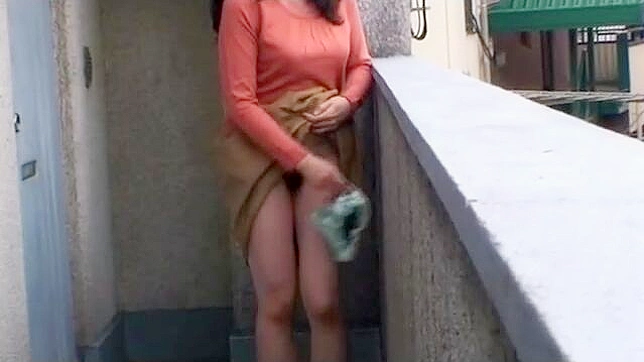 Naughty MILF From Japan Pleasures Herself in Public, Orgasms on the Balcony