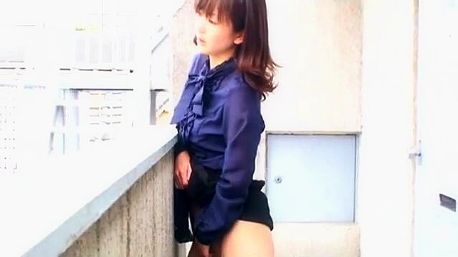 Alluring mature japanese woman giving into her deepest desires, reaching the peak of ecstasy on the balcony.