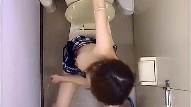 Spying on a lewd Japanese office lady getting off in the toilet.