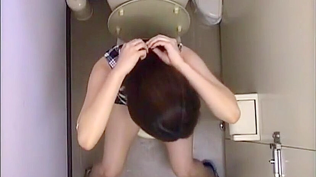 Spying on a lewd Japanese office lady getting off in the toilet.