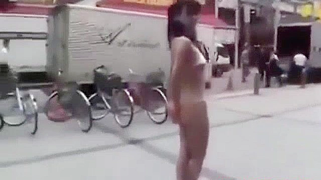 Japanese Beauty Walks Semi-Nude in Tokyo Street - HD Video