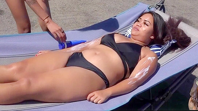 Japanese Babe Gets a Taste of Sun Tan Lotion, Gets Rubbed Down by a Stranger