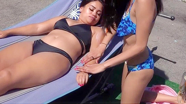 Japanese Babe Gets a Taste of Sun Tan Lotion, Gets Rubbed Down by a Stranger